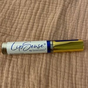 Sealed lip sense gold glitter gloss